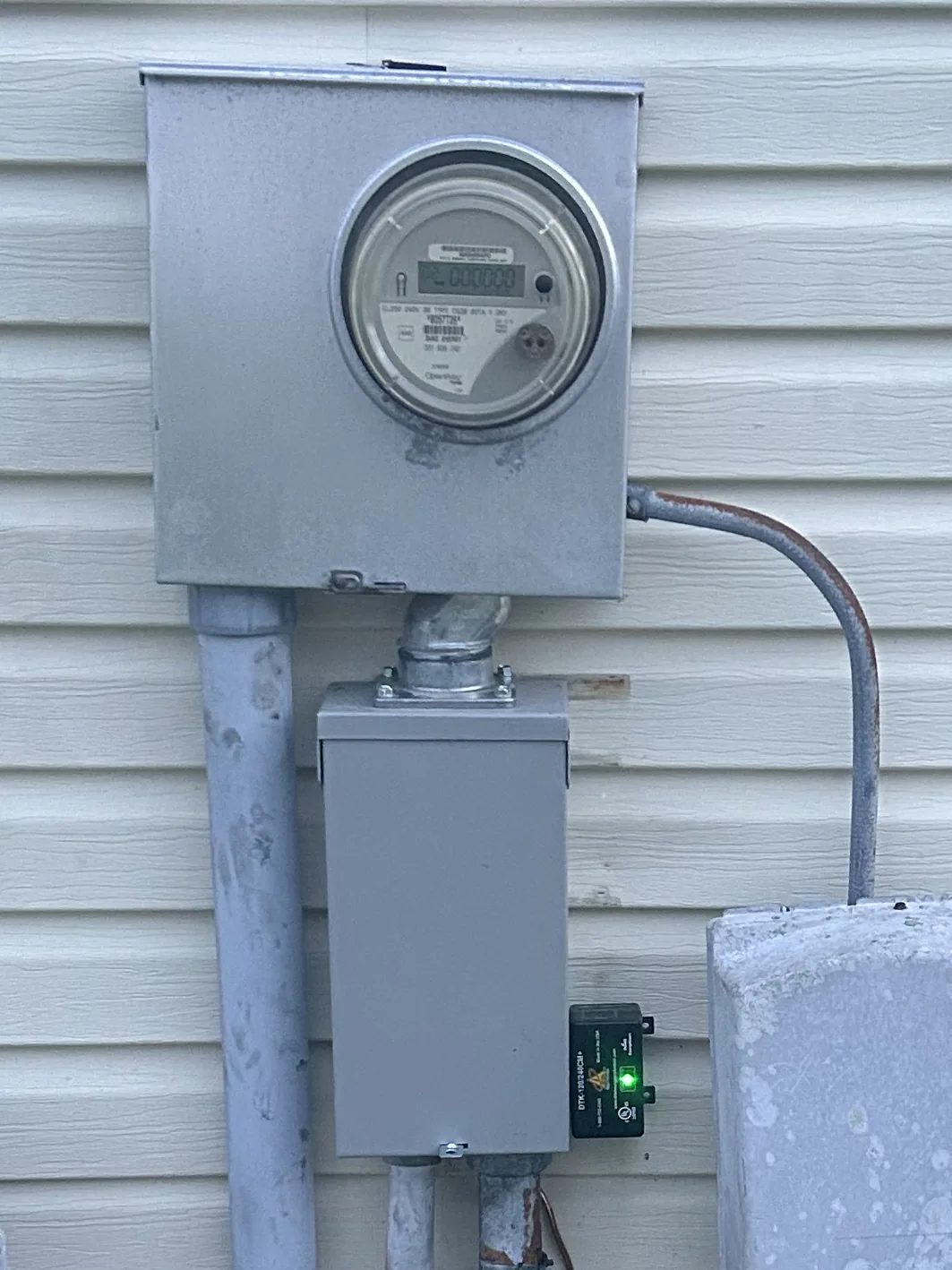 Largo, FL electrical work by Keywest Lights & Electric: new NEMA 3R outdoor breaker box with a whole-home surge protector below the meter