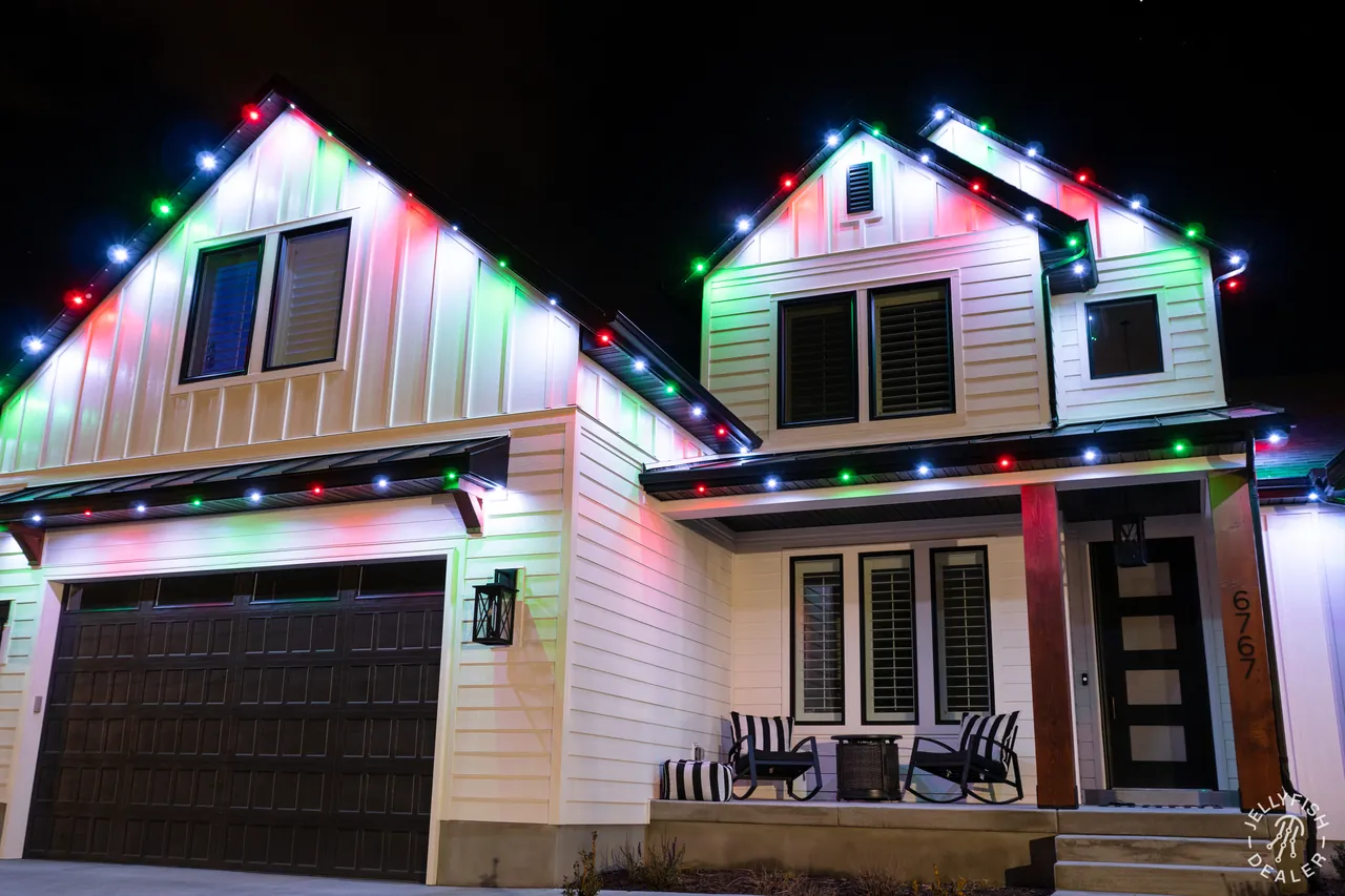 Multicolor Christmas JellyFish permanent roofline lights on a Seminole, FL home