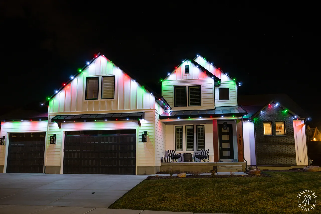 Multicolor Christmas JellyFish permanent roofline lights on a St. Pete Beach, FL home