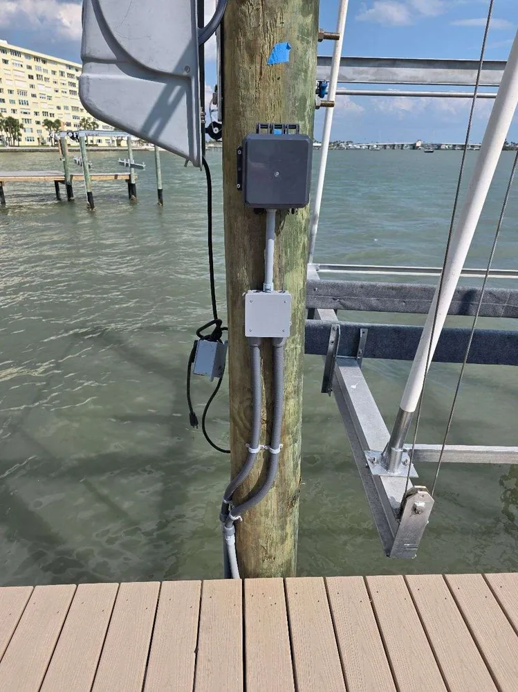 After: new weatherproof boxes and conduit on the dock piling, installed by Keywest Lights & Electric
