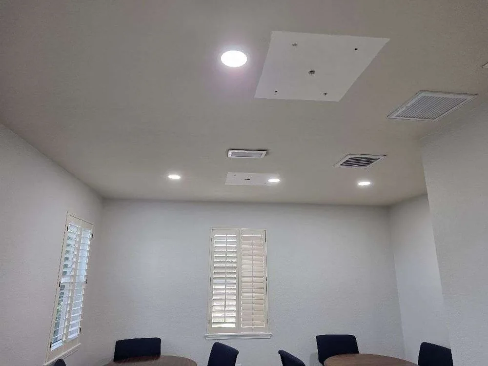 Home Commercial lighting remodel in St. Petersburg, FL – after: the same meeting room with new recessed lighting