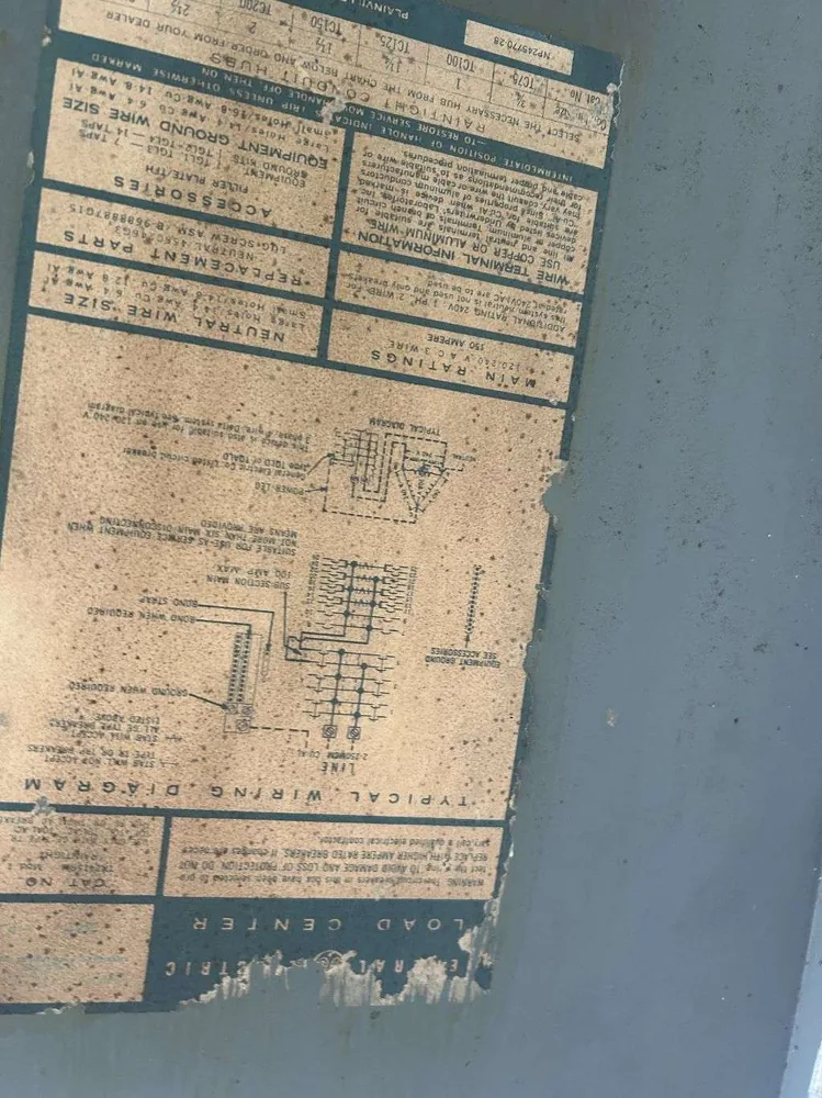 Panel replacement in St. Petersburg, FL – before the old panel's faded, peeling label