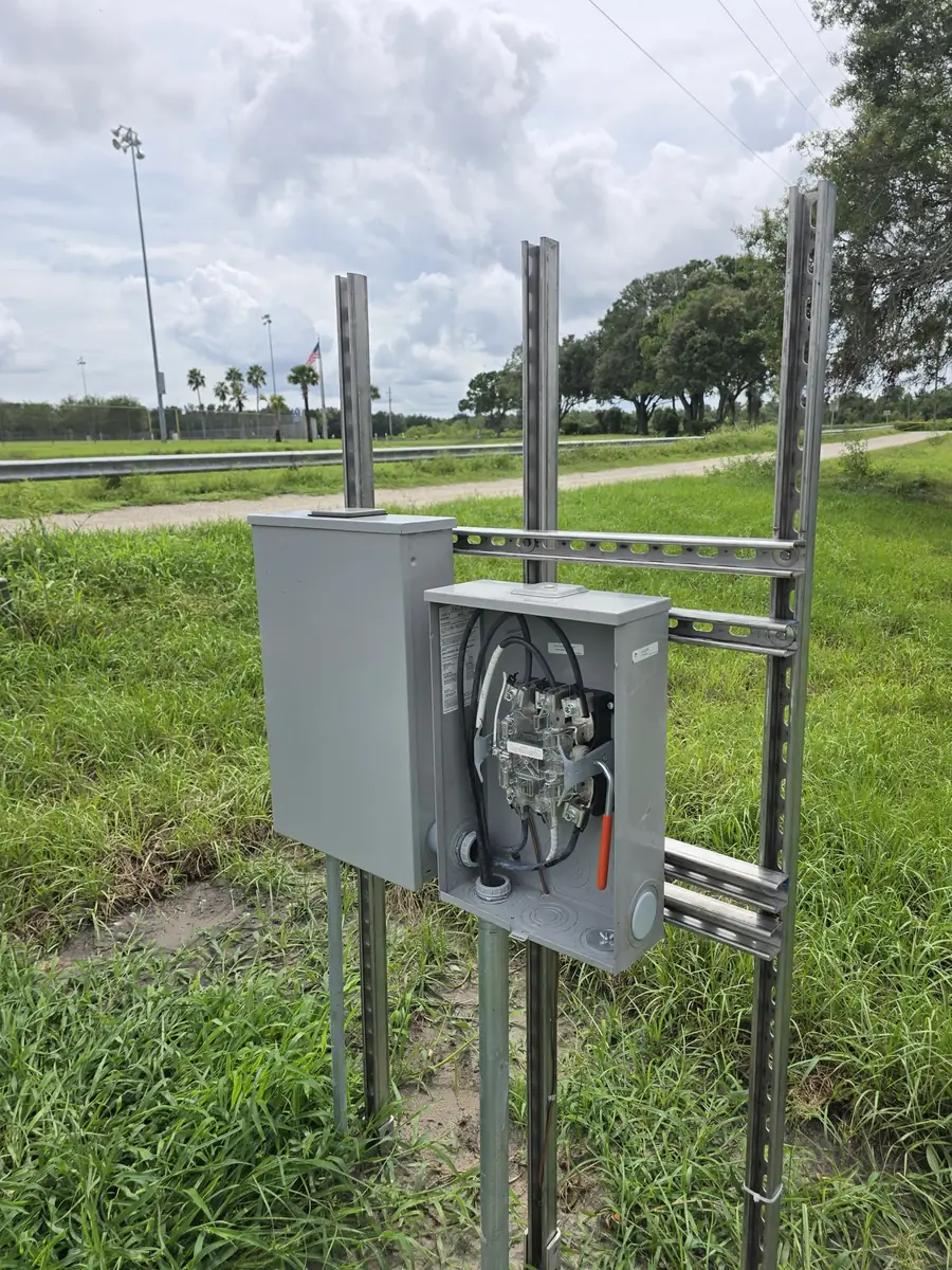 New meter and disconnect on a strut rack at a public park with ballfield lighting, Polk County