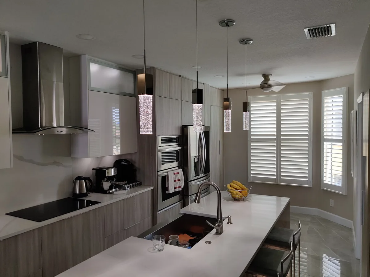 Ceiling Fan & Light Fixture Installation in Seminole, FL Pendant lights over a kitchen island installed by Keywest Lights & Electric during a remodel