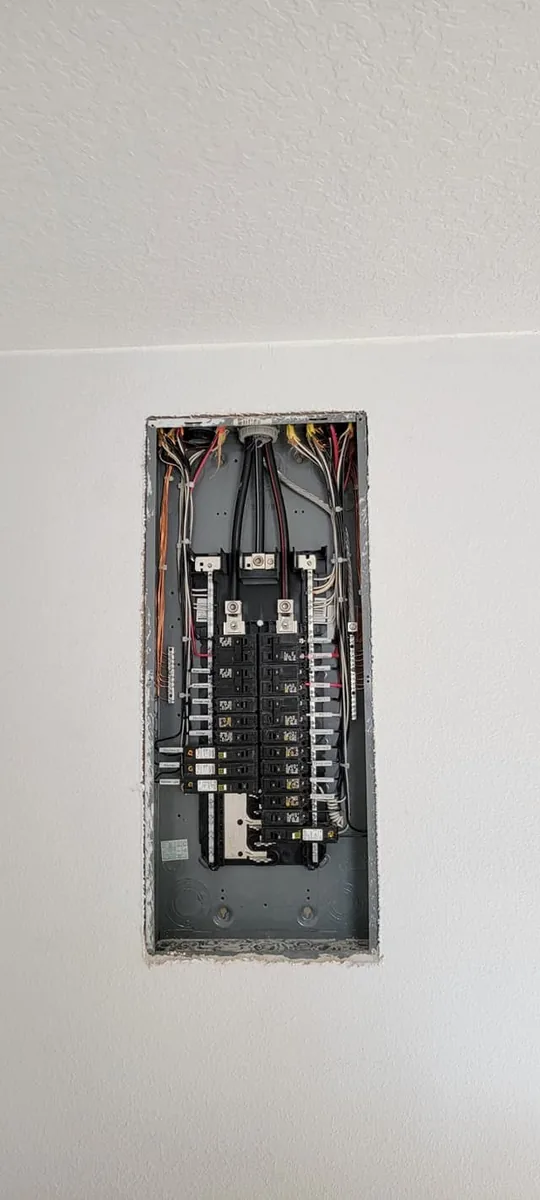 Flush-mounted replacement panel set in fresh drywall, wired by Keywest Lights & Electric and ready for its cover