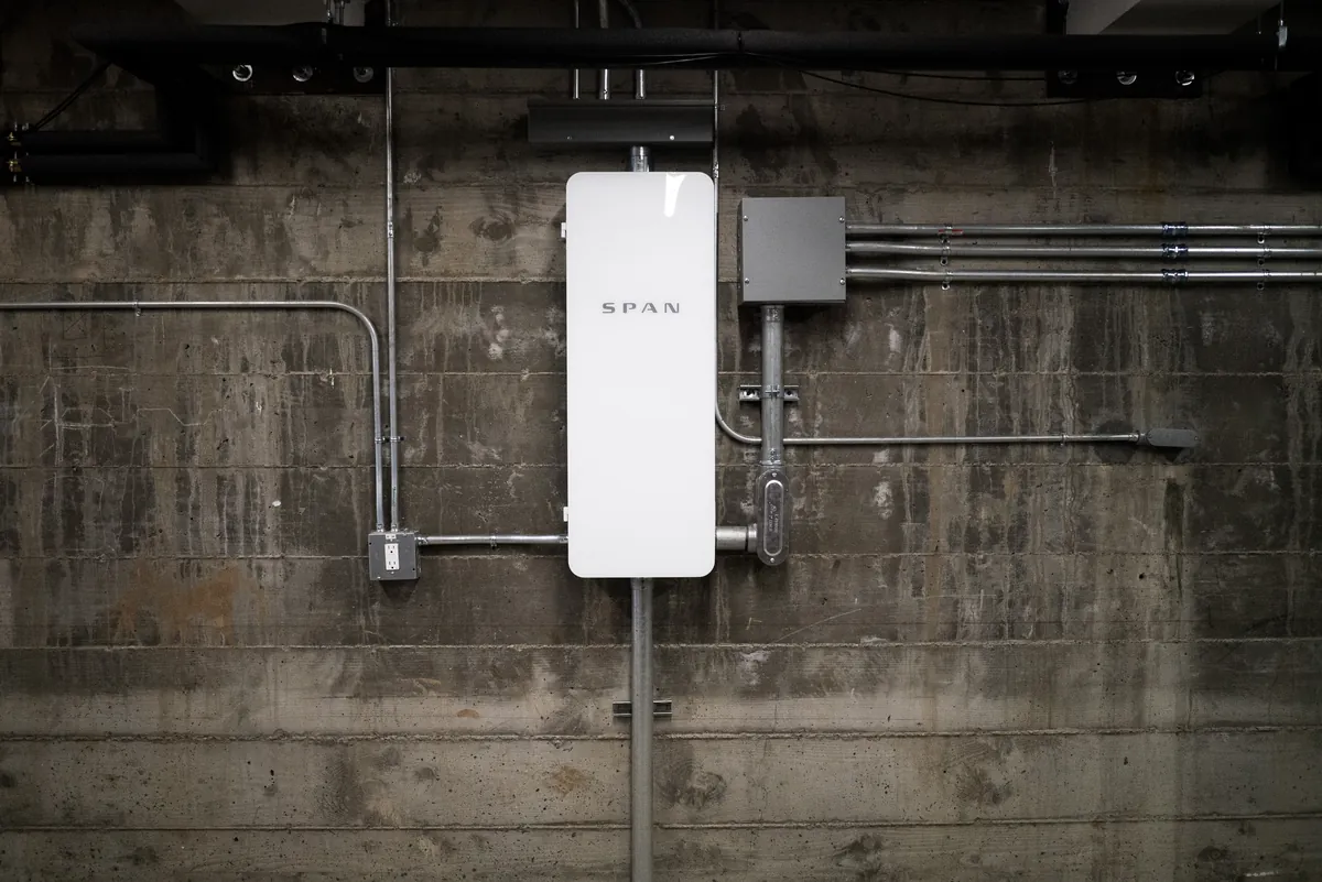 SPAN Smart Panel Installation in St. Pete Beach & Treasure Island, FL SPAN Panel installed on a concrete block wall with conduit runs to the meter and disconnect