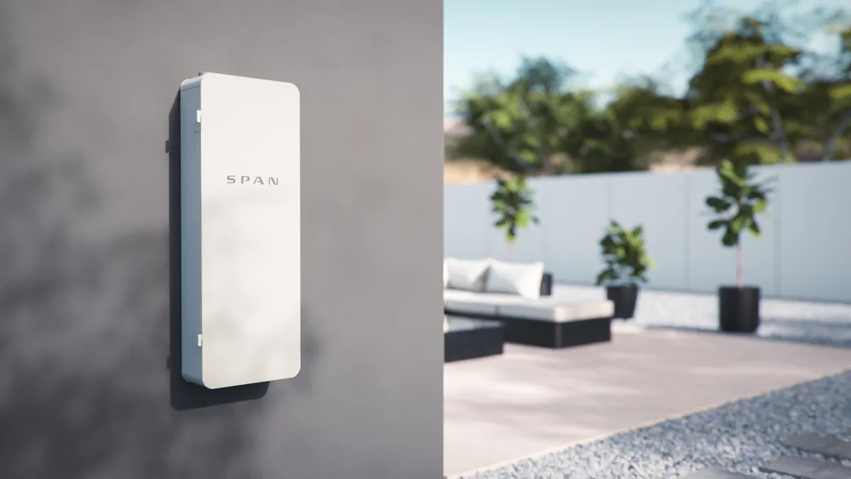 SPAN Smart Panel Installation in St. Pete Beach & Treasure Island, FL SPAN Panel mounted on an exterior wall beside a backyard patio