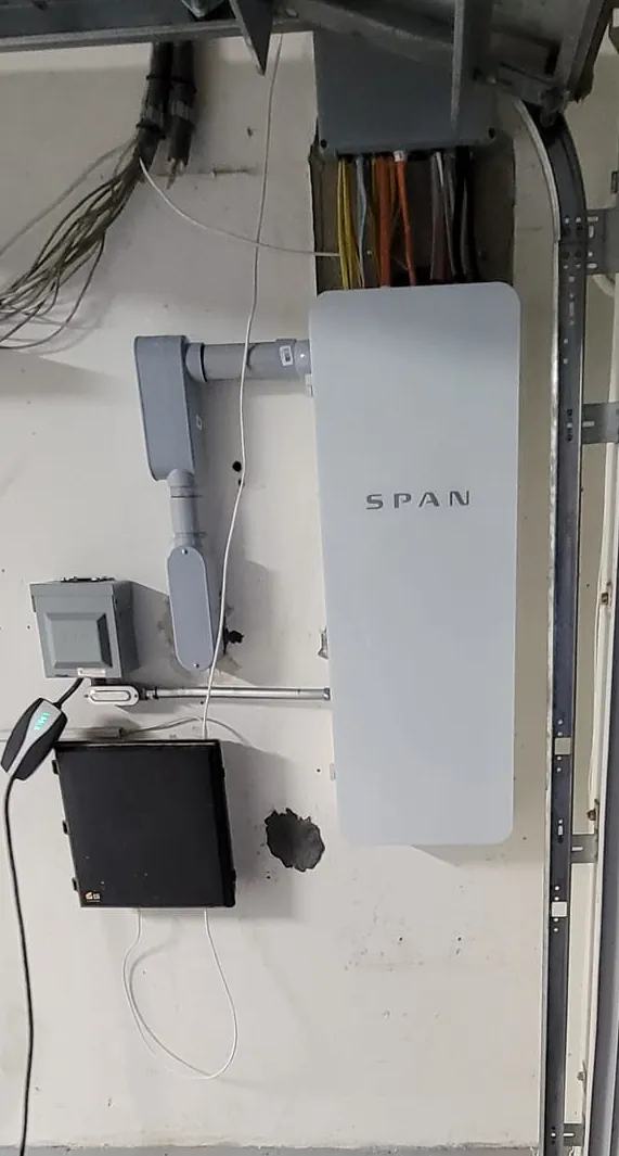 SPAN smart panel installed on a garage wall