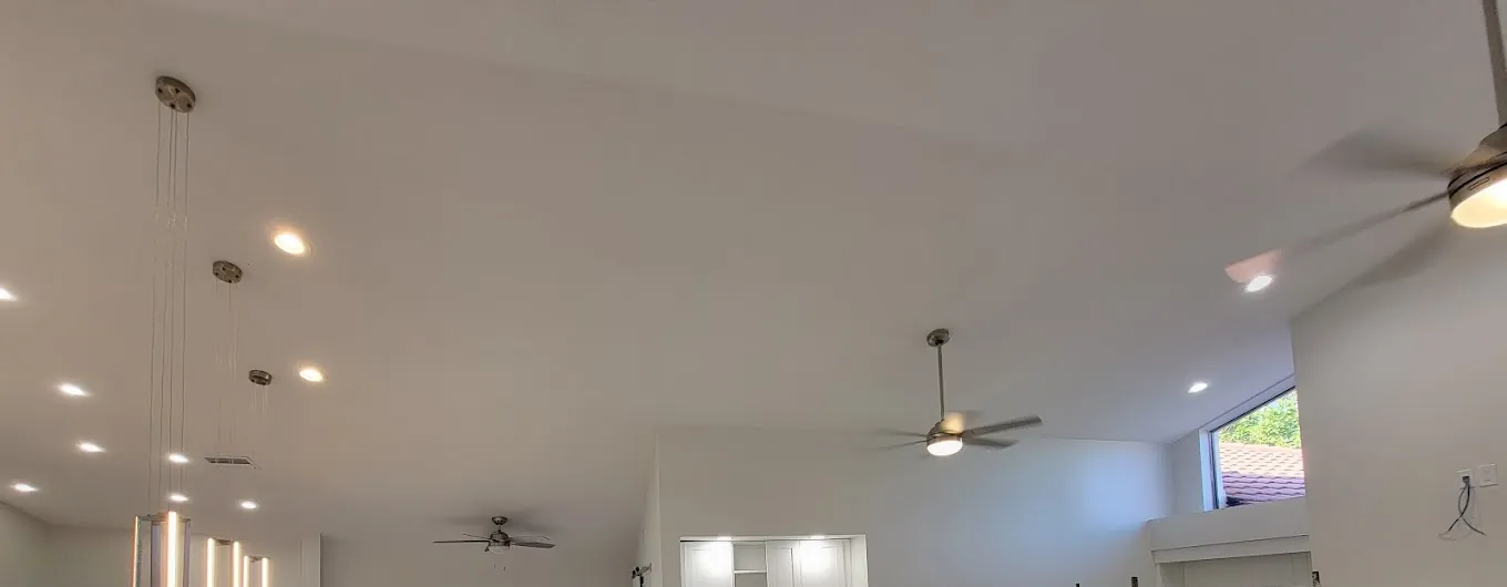 Vaulted great room with recessed LED lights, LED pendants and ceiling fans